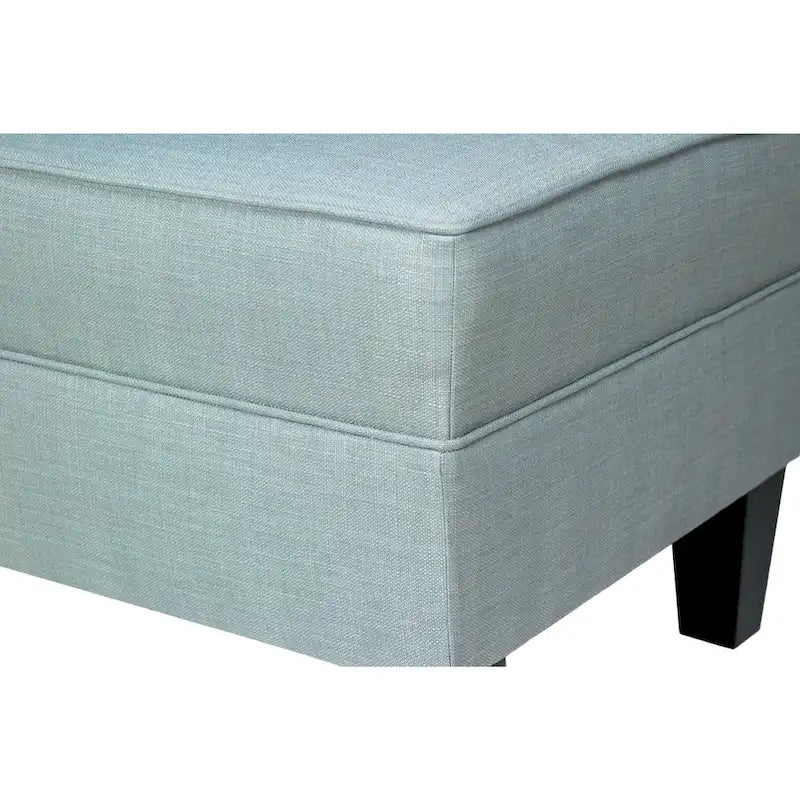 Pouf quadrato rivestito in tessuto con profilo saldato