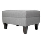 Pouf quadrato rivestito in tessuto con profilo saldato