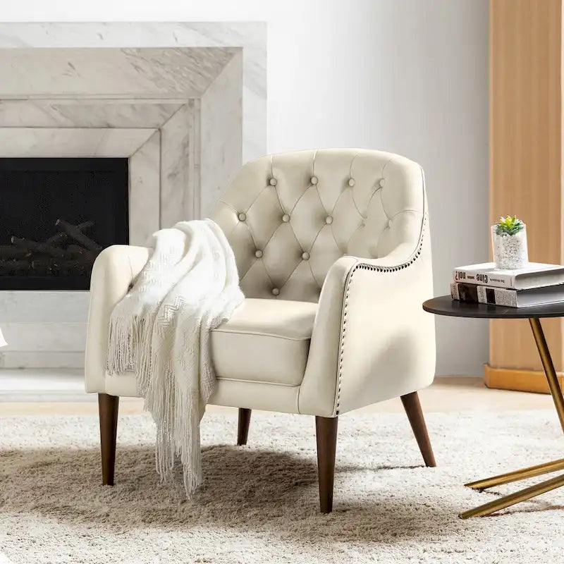 Poltrona a botte classica in vera pelle con gambe in legno e schienale capitonné