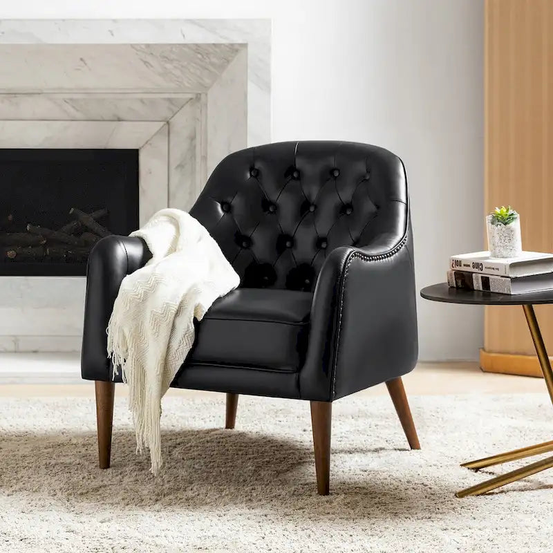 Poltrona a botte classica in vera pelle con gambe in legno e schienale capitonné